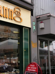 HANGING CAT by EL BOCHO